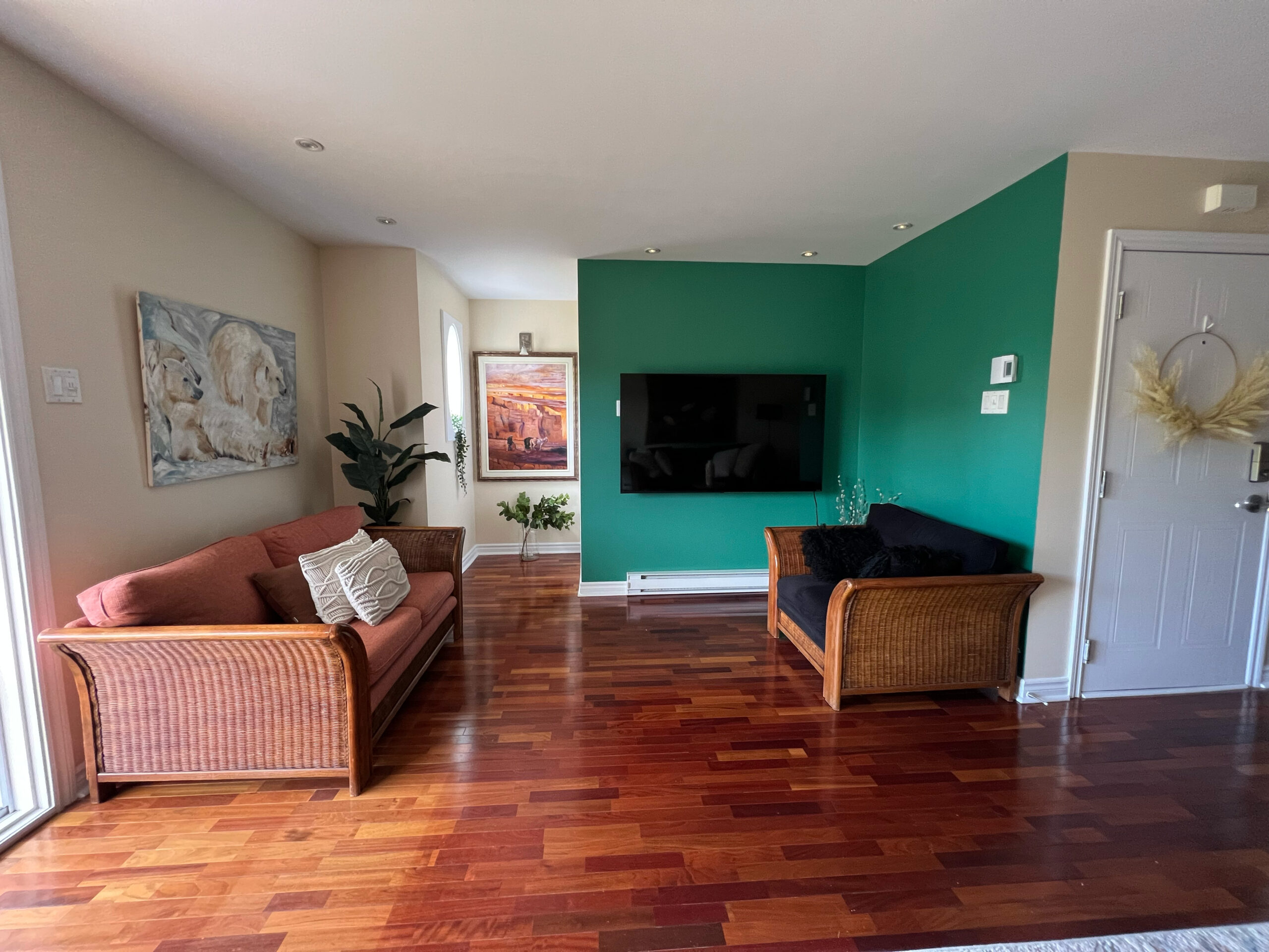 Room with teal accent wall by Monique Paré