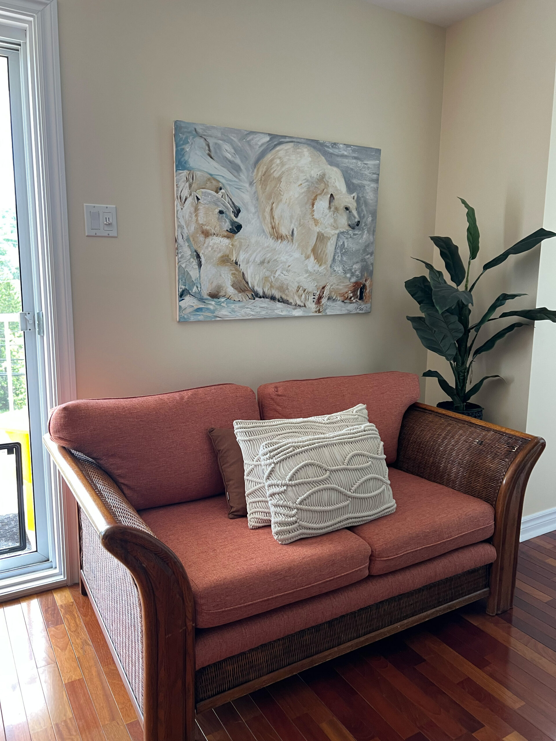 Living room with teal accent wall designed by Monique Paré